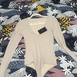 Deep v neck bodysuit with removable padding.